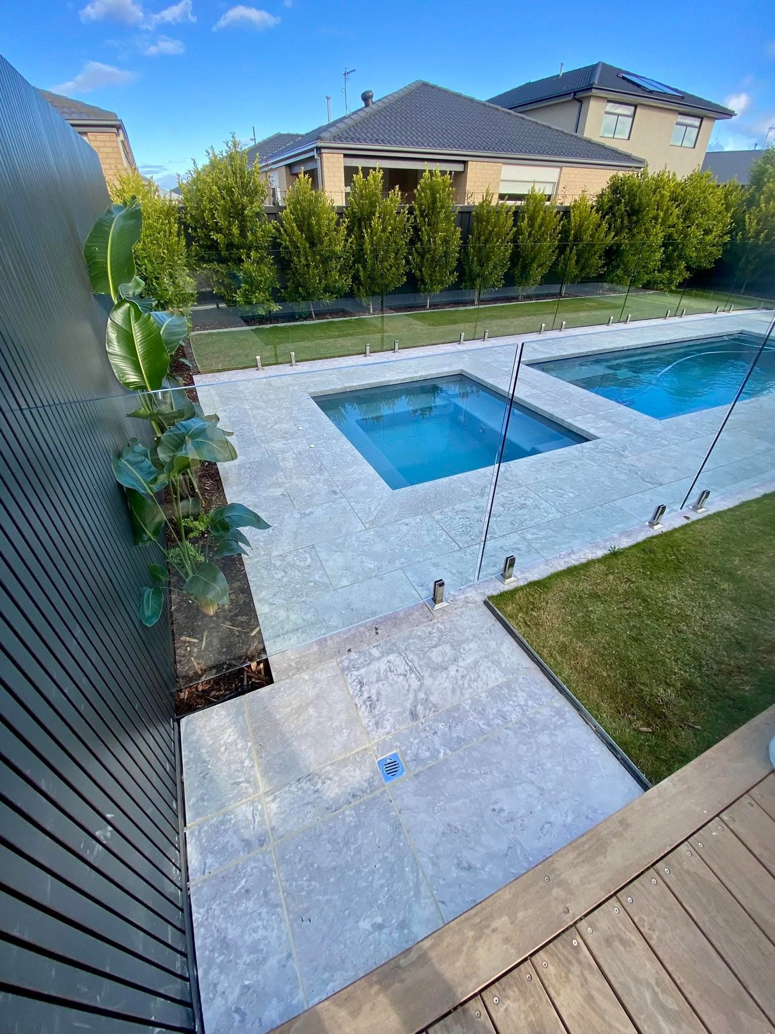 Poolside pad & travertine paving